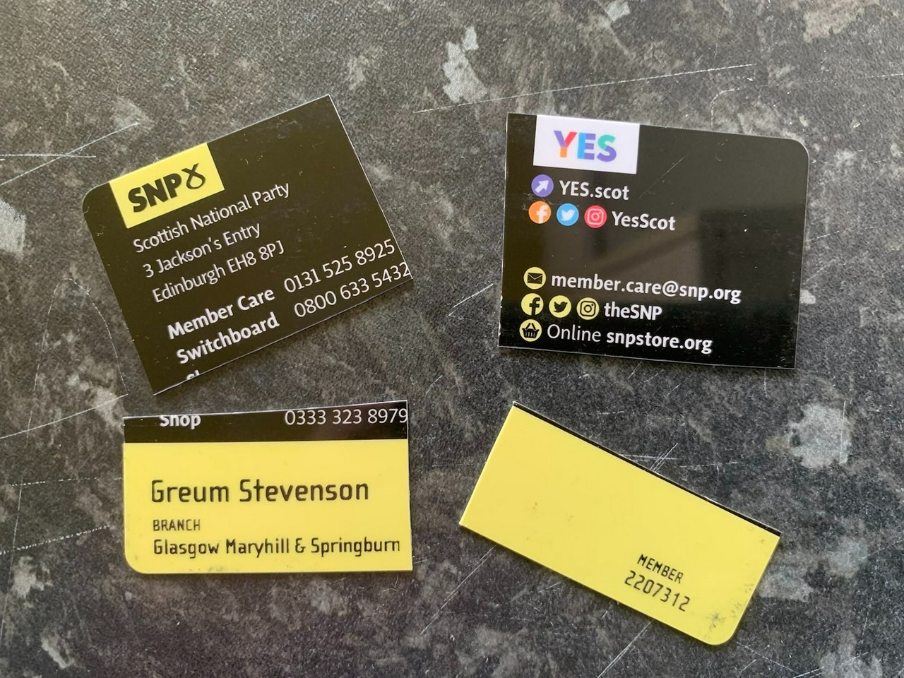 an SNP membership card that has been cut into four pieces